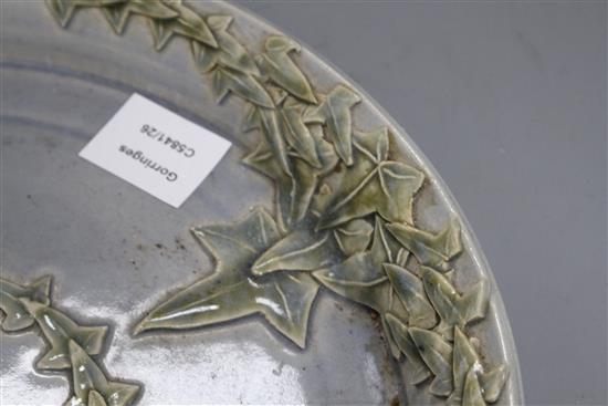 A Studio pottery tray, decorated with ivy leaves, seal mark to rim JC, diameter 35cm